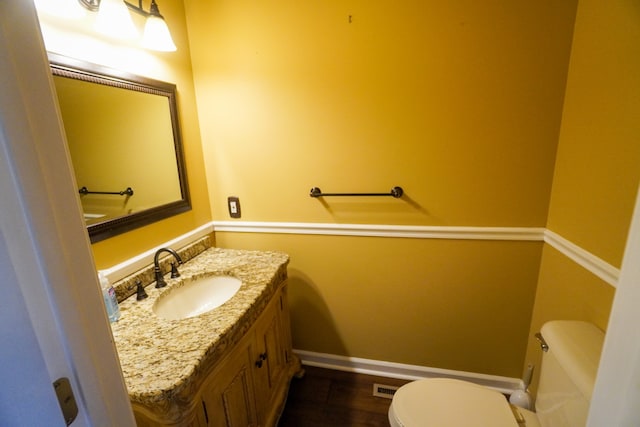 bathroom with vanity and toilet