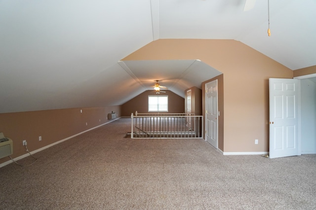 bonus room with lofted ceiling, carpet floors, and ceiling fan