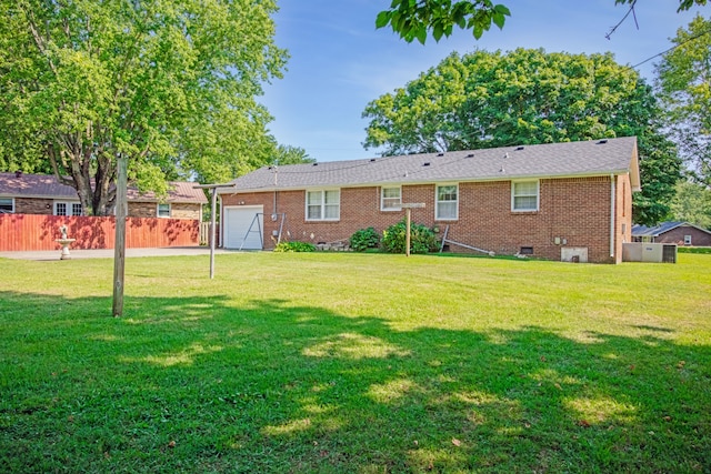 back of property featuring a yard