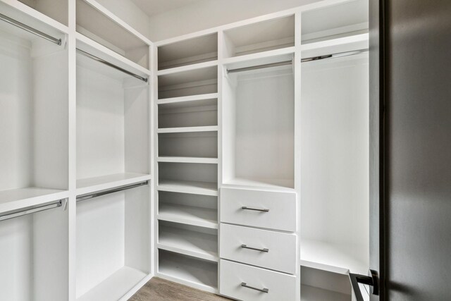 walk in closet featuring hardwood / wood-style floors