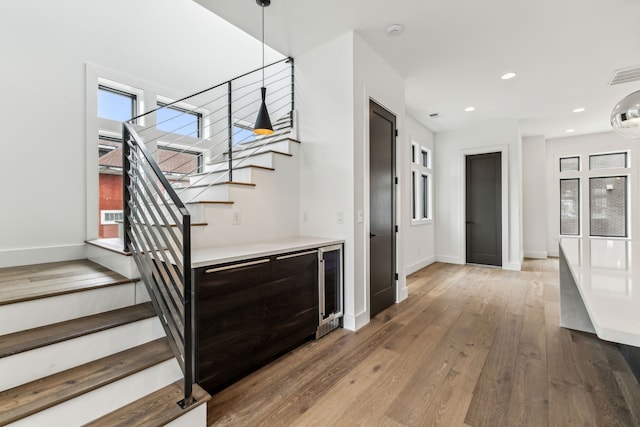 stairs featuring wood-type flooring