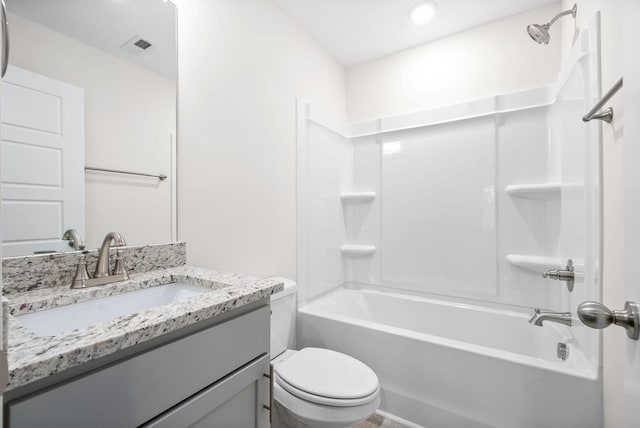 full bathroom featuring toilet, vanity, and tub / shower combination