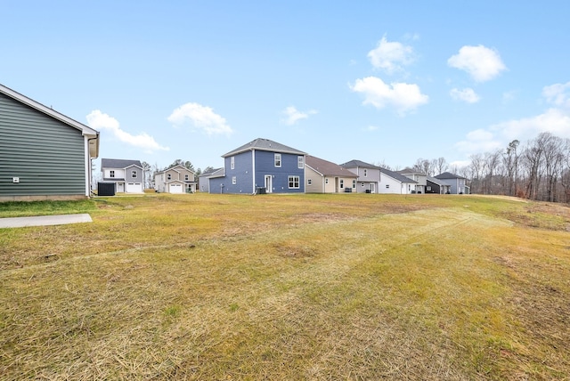 view of yard with central AC