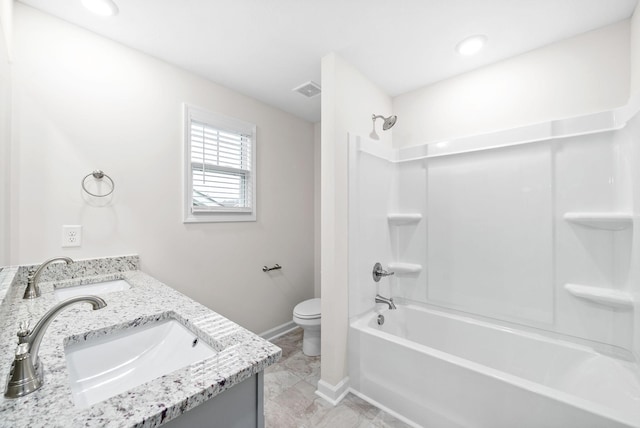 full bathroom with bathtub / shower combination, vanity, and toilet