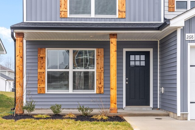 doorway to property featuring covered porch