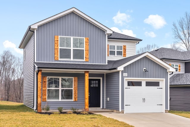 view of front of property with a front yard, a garage, and a porch