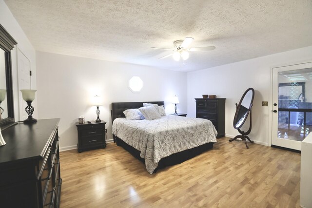 bedroom with access to outside, a textured ceiling, ceiling fan, and light hardwood / wood-style floors