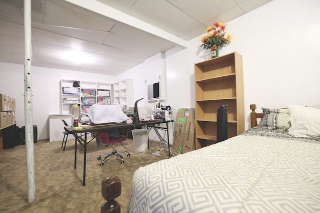 carpeted bedroom with a paneled ceiling