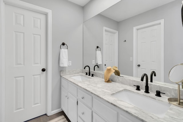 bathroom featuring tile patterned flooring and double vanity