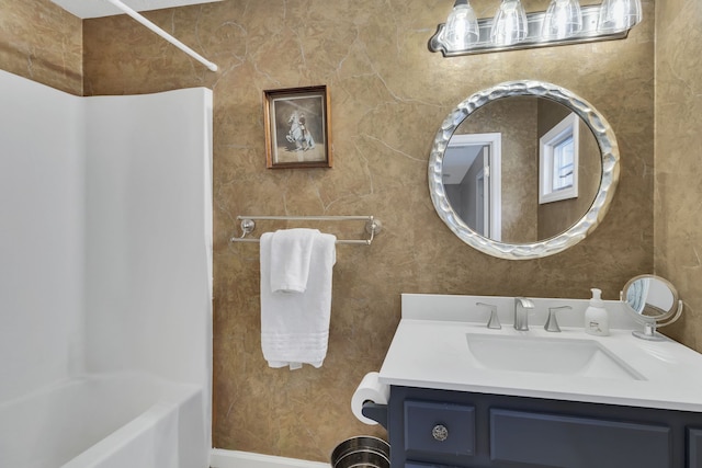 bathroom featuring shower / washtub combination and vanity