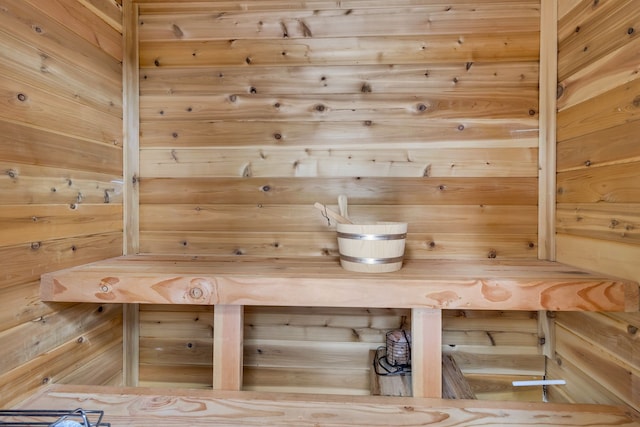 view of sauna with wood walls