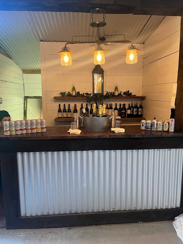 bar with lofted ceiling, wooden ceiling, and radiator