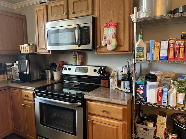 kitchen with crown molding and stainless steel appliances