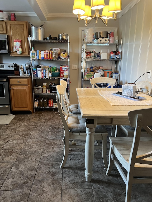 tiled dining room featuring crown molding and a chandelier