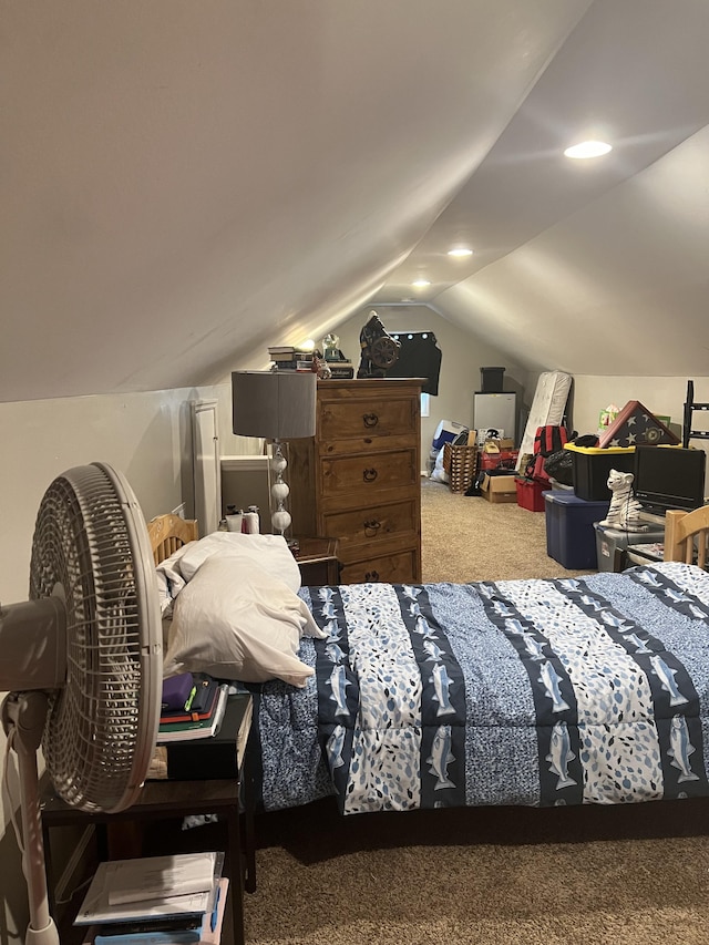 bedroom with vaulted ceiling and carpet flooring