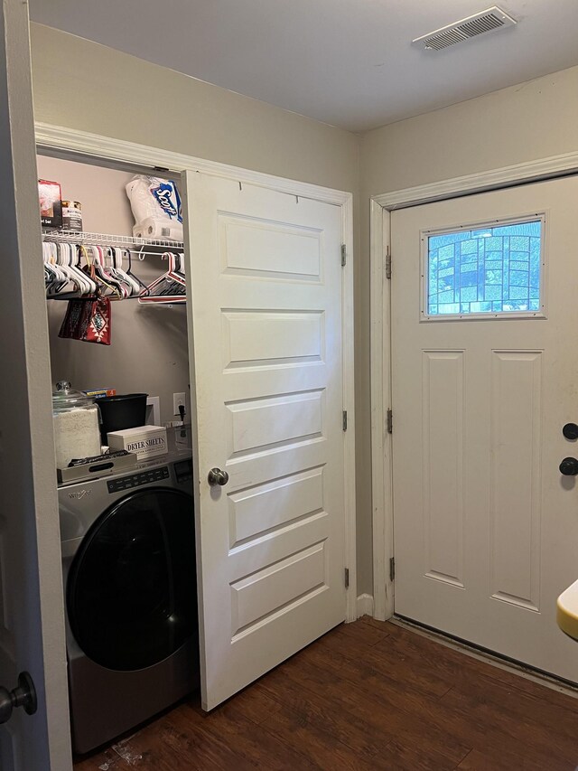 laundry area featuring washer / dryer and dark wood-type flooring