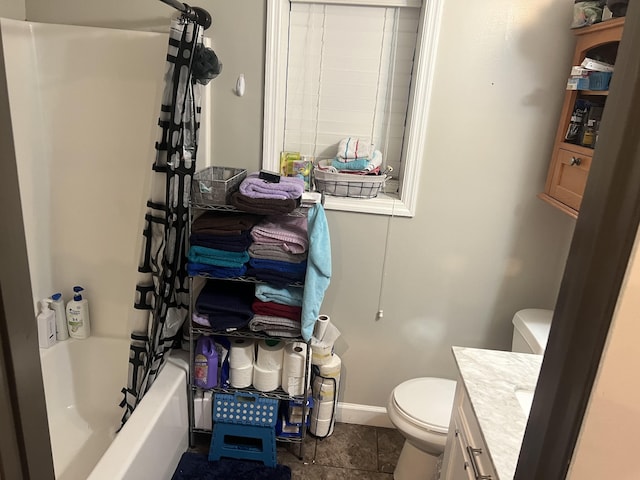 full bathroom featuring tile patterned floors, shower / bath combination, vanity, and toilet