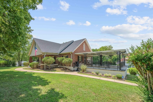 view of front of home with brick siding and a front lawn