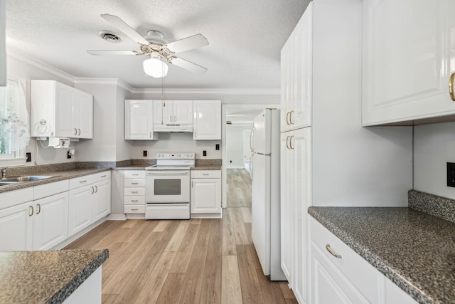 kitchen featuring visible vents, under cabinet range hood, white appliances, crown molding, and light wood finished floors