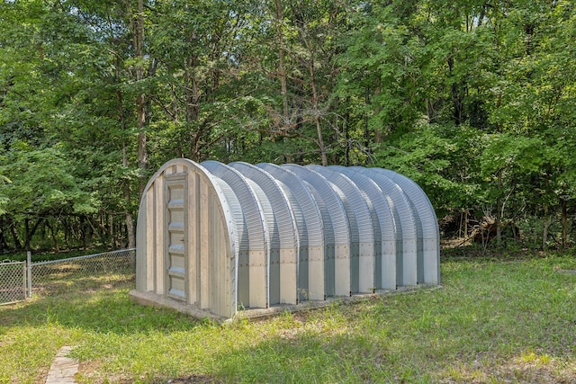 exterior details featuring an exterior structure and fence