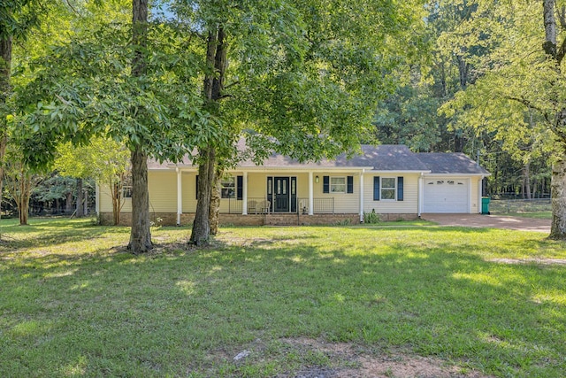 ranch-style house featuring a front yard, an attached garage, covered porch, and driveway