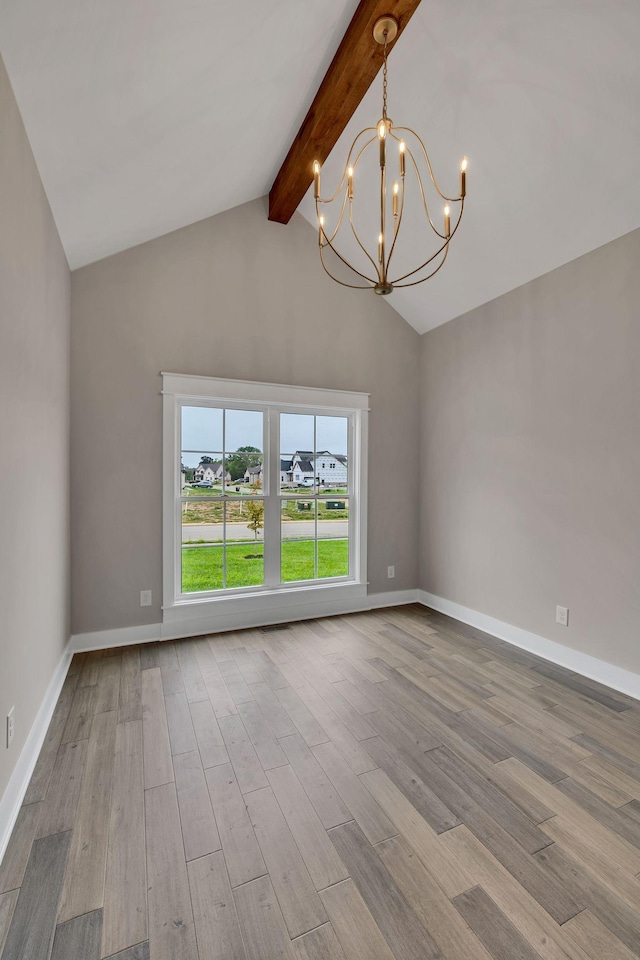 empty room with lofted ceiling with beams, baseboards, an inviting chandelier, and wood finished floors