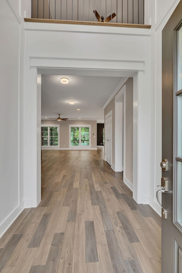 hall with light wood-type flooring