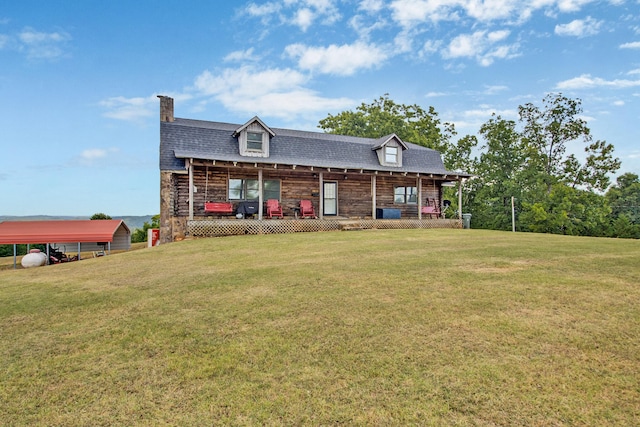 view of front facade with a front lawn, a carport, and a porch