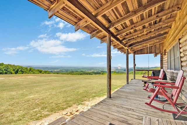 wooden terrace with a yard