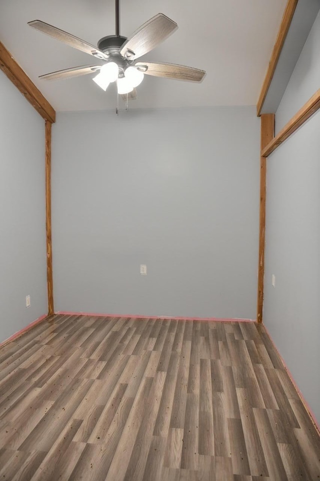 unfurnished room with hardwood / wood-style floors and ceiling fan