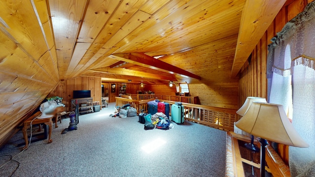 interior space featuring wood walls, carpet flooring, lofted ceiling, and wooden ceiling