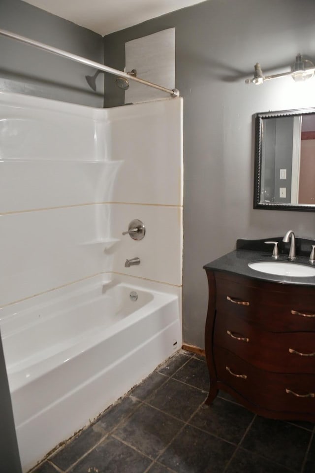 bathroom with tub / shower combination, vanity, and tile patterned flooring