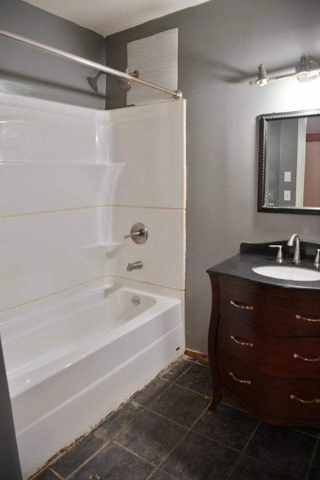 bathroom featuring tile patterned flooring, vanity, and shower / bathtub combination