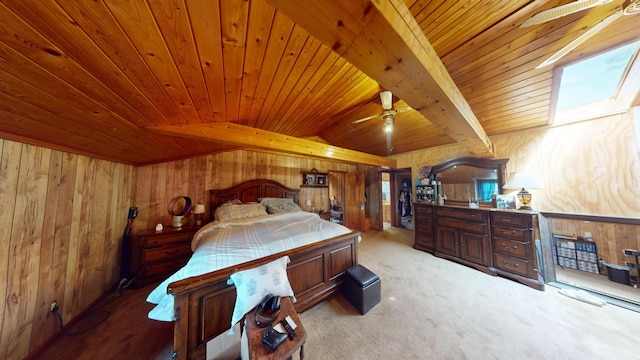 bedroom featuring wood ceiling, light carpet, beam ceiling, and wooden walls