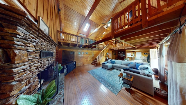 living room with wooden ceiling, high vaulted ceiling, beam ceiling, and hardwood / wood-style floors