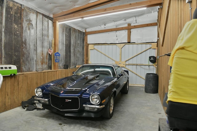 garage with wood walls