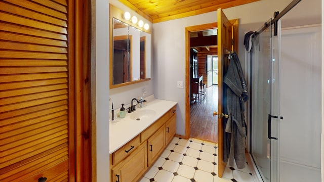 bathroom featuring vanity, an enclosed shower, wood ceiling, and wood-type flooring