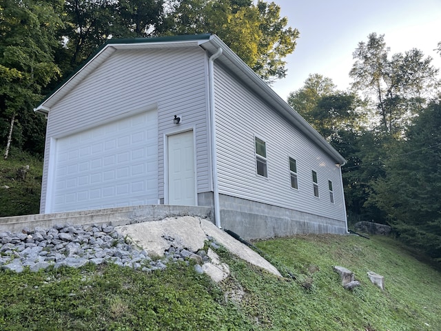 view of property exterior featuring a garage