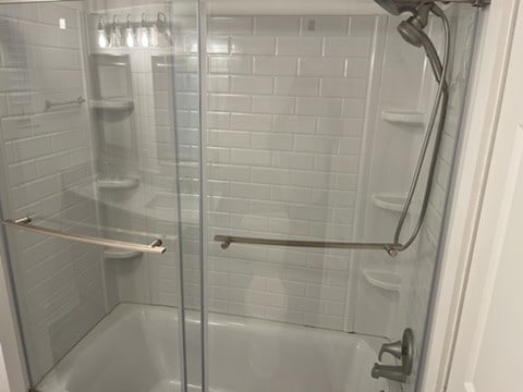 bathroom featuring enclosed tub / shower combo