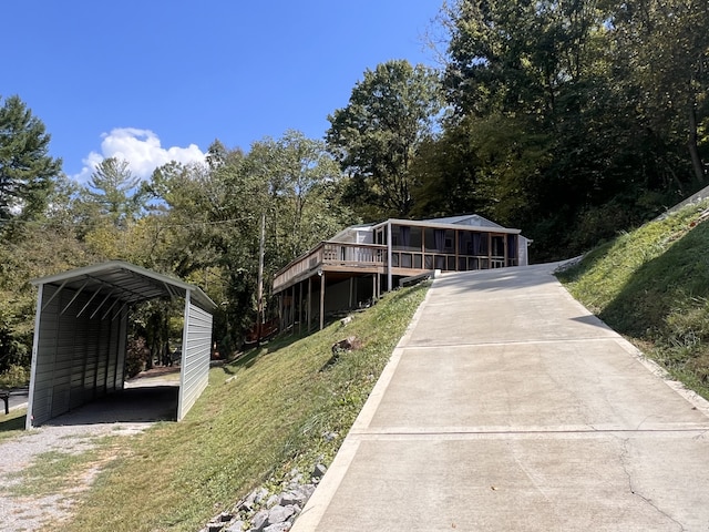 view of front of property with a carport and a front yard