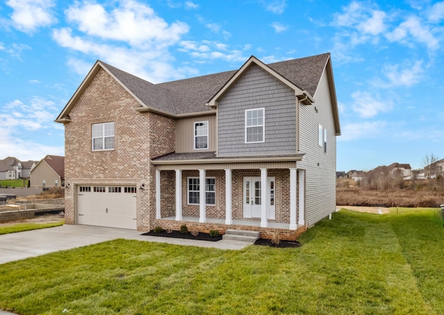 view of front facade featuring a front lawn, covered porch, and a garage