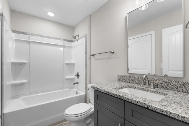 full bathroom with vanity, toilet, and washtub / shower combination