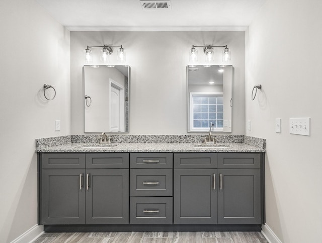 bathroom featuring vanity and wood-type flooring