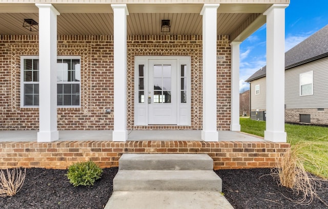 entrance to property featuring covered porch