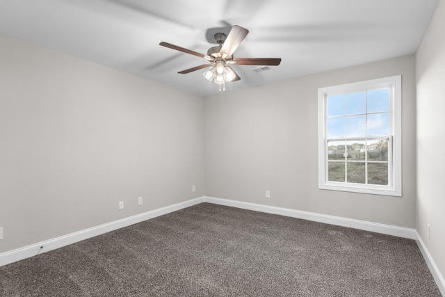 empty room featuring carpet flooring and ceiling fan