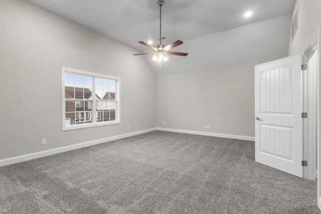 carpeted spare room featuring ceiling fan and high vaulted ceiling