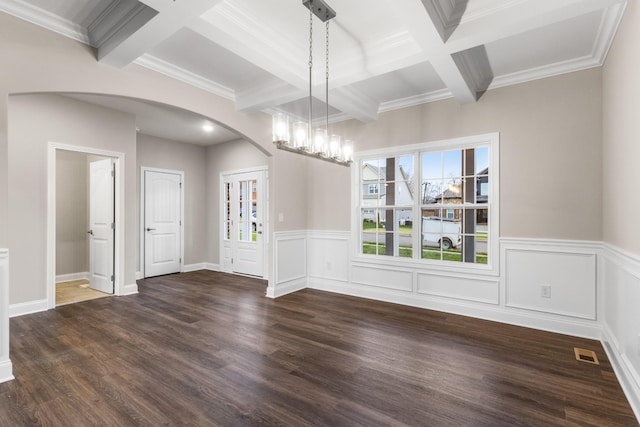 unfurnished dining area featuring beam ceiling, dark hardwood / wood-style flooring, coffered ceiling, and ornamental molding