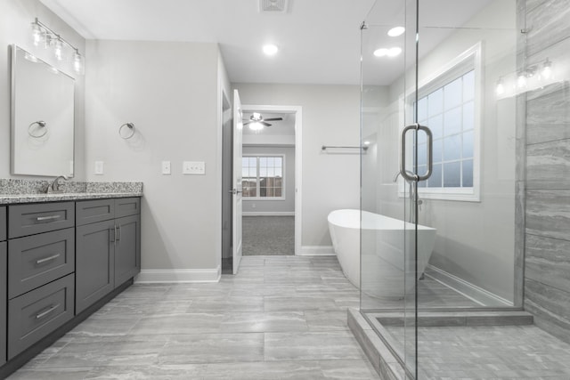 bathroom with ceiling fan, plus walk in shower, and vanity