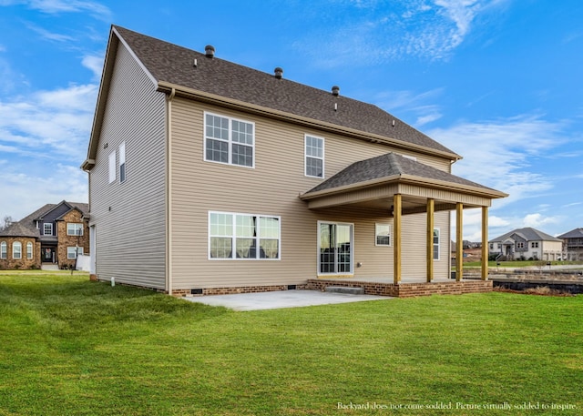 back of property featuring a lawn and a patio