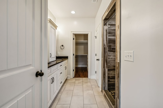 bathroom with vanity and hardwood / wood-style floors